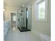Bathroom featuring a modern shower, vanity, and marble floors at 3207 Bold Springs Rd, Dacula, GA 30019