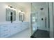 Large bathroom featuring a glass shower, dual vanity, and modern fixtures at 3207 Bold Springs Rd, Dacula, GA 30019