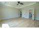 Neutral bedroom featuring hardwood floors and access to an ensuite bathroom at 3207 Bold Springs Rd, Dacula, GA 30019
