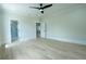 Neutral bedroom with hardwood floors and ensuite bathroom at 3207 Bold Springs Rd, Dacula, GA 30019