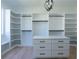 Custom walk-in closet with built-in shelving, drawers, and hanging rods, maximizing storage and organization at 3207 Bold Springs Rd, Dacula, GA 30019