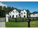 Lovely two-story home with a manicured lawn, long driveway, and mailbox at 3207 Bold Springs Rd, Dacula, GA 30019