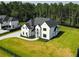 Charming two-story home with a long driveway and green lawn at 3207 Bold Springs Rd, Dacula, GA 30019