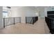 Bright open foyer with hardwood floors, black railing and a view of the dining and living room at 3207 Bold Springs Rd, Dacula, GA 30019