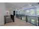 Second floor foyer features hardwood floors, decorative lighting and provides views to multiple living spaces at 3207 Bold Springs Rd, Dacula, GA 30019