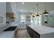 Modern kitchen featuring a center island, white cabinets, modern appliances, and an open layout at 3207 Bold Springs Rd, Dacula, GA 30019