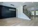Open concept room with a decorative wall and hardwood floors at 3207 Bold Springs Rd, Dacula, GA 30019