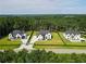 Aerial view of houses in a neighborhood surrounded by lush green trees and nature at 3207 Bold Springs Rd, Dacula, GA 30019