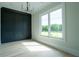 Office with a decorative wall and a view of the green lawn at 3207 Bold Springs Rd, Dacula, GA 30019