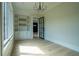 Bright office with built-in shelves and a view of the green lawn at 3207 Bold Springs Rd, Dacula, GA 30019