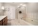 Clean bathroom featuring a soaking tub, glass shower, and a white tile floor at 429 Mountain View Ln, Woodstock, GA 30188