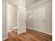 Bathroom with wood floor, showcasing a toilet and white door, offering style and function at 429 Mountain View Ln, Woodstock, GA 30188
