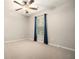 Bedroom with large windows, neutral carpet and ceiling fan at 429 Mountain View Ln, Woodstock, GA 30188