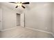 Bedroom with neutral carpet, ceiling fan, and a closet with double doors at 429 Mountain View Ln, Woodstock, GA 30188