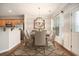 Bright dining area with modern light fixture, stylish rug, and view to the kitchen area at 429 Mountain View Ln, Woodstock, GA 30188