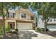 Attractive townhome with a two-car garage, landscaped yard, and a welcoming entrance at 429 Mountain View Ln, Woodstock, GA 30188