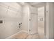 The laundry room features tile floors and a wire rack at 429 Mountain View Ln, Woodstock, GA 30188