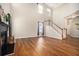 Spacious living room with fireplace and large windows, offering ample natural light and a cozy atmosphere at 429 Mountain View Ln, Woodstock, GA 30188