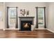Inviting living room with a fireplace and large windows, blending style and comfort at 429 Mountain View Ln, Woodstock, GA 30188