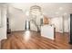 Spacious living room featuring hardwood floors, high ceilings, and a seamless flow to the kitchen at 429 Mountain View Ln, Woodstock, GA 30188