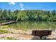 Scenic pond in community with bench and wooden dock at 429 Mountain View Ln, Woodstock, GA 30188