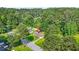 An aerial view of a home nestled among mature trees at 2454 Fairway Sw Cir, Atlanta, GA 30331