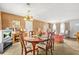 Dining area with a wooden table set next to the living room with bright natural lighting at 2454 Fairway Sw Cir, Atlanta, GA 30331