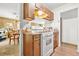 Modest kitchen space with an oven, wood cabinets, and breakfast nook at 2454 Fairway Sw Cir, Atlanta, GA 30331