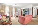 Comfortable living room with carpet, chairs, and lots of light from the windows at 2454 Fairway Sw Cir, Atlanta, GA 30331