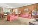 Spacious living area with ample seating, a dining area, and a sliding glass door at 2454 Fairway Sw Cir, Atlanta, GA 30331