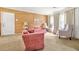 Inviting living room with plush seating, textured walls, and large windows at 2454 Fairway Sw Cir, Atlanta, GA 30331