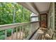 Cozy balcony offers outdoor seating with views of the surrounding trees and the building entrance at 2703 Country Park Dr, Smyrna, GA 30080