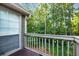 Balcony area with a view surrounded by lush greenery, perfect for relaxation and enjoying nature at 2703 Country Park Dr, Smyrna, GA 30080