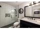 Modern bathroom featuring a glass enclosed shower and a vanity with dark cabinetry and white countertops at 2703 Country Park Dr, Smyrna, GA 30080