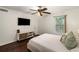 This bedroom boasts a ceiling fan and a mounted TV for ultimate comfort and entertainment at 2703 Country Park Dr, Smyrna, GA 30080