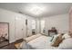 This bedroom features a large bed, unique wallpaper, modern lighting, and ensuite access for convenience and style at 2703 Country Park Dr, Smyrna, GA 30080