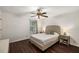 Bright bedroom with wood floors has a ceiling fan and neutral decor at 2703 Country Park Dr, Smyrna, GA 30080