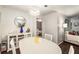Bright dining room featuring hardwood floors, modern decor and a view into the living room at 2703 Country Park Dr, Smyrna, GA 30080