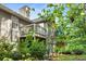 Exterior of house with two-level deck surrounded by lush trees and shrubbery, creating a private outdoor space at 2703 Country Park Dr, Smyrna, GA 30080