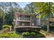 Condominiums with exterior stairs, porches and professional landscaping with lush greenery and trees at 2703 Country Park Dr, Smyrna, GA 30080