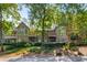 Condominiums with private balconies surrounded by greenery, shrubs, and mature trees at 2703 Country Park Dr, Smyrna, GA 30080