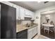 Charming kitchen featuring granite counters, stainless-steel appliances, and access to a cozy dining area at 2703 Country Park Dr, Smyrna, GA 30080