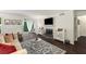 Bright living room featuring a fireplace, white walls, hardwood floors and a large window at 2703 Country Park Dr, Smyrna, GA 30080