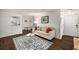 Open-concept living room featuring hardwood floors, neutral decor, and seamless flow to other spaces at 2703 Country Park Dr, Smyrna, GA 30080