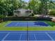 A well-maintained tennis court is surrounded by lush greenery, offering a serene setting for recreational play at 2703 Country Park Dr, Smyrna, GA 30080