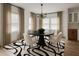 Bright dining room with modern chandelier and large windows at 32 Wadley Nw St, Atlanta, GA 30314