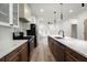 Modern kitchen featuring stainless steel appliances, marble countertops and wood cabinets at 32 Wadley Nw St, Atlanta, GA 30314