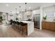 Modern kitchen featuring a large island, stainless steel appliances, and eat-in dining area at 32 Wadley Nw St, Atlanta, GA 30314