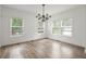 Bright living room with a modern light fixture and many windows at 32 Wadley Nw St, Atlanta, GA 30314