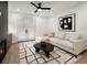 Cozy living room with a sectional sofa, fireplace, and doors to the outside at 32 Wadley Nw St, Atlanta, GA 30314